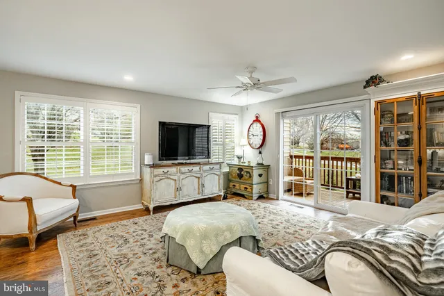 a spacious bedroom with a large bed and a flat screen tv