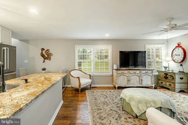 a bedroom with a bed and a flat screen television