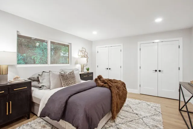 a bed room with a bed and a window