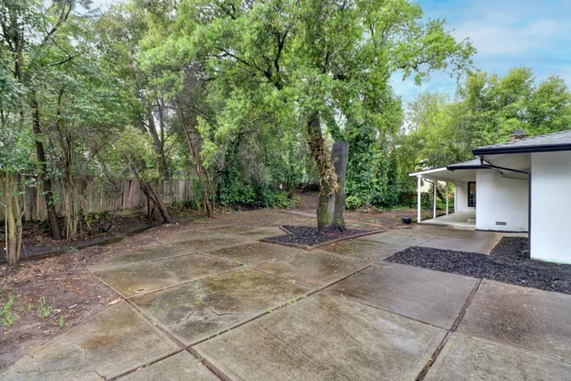 a view of a house with a tree