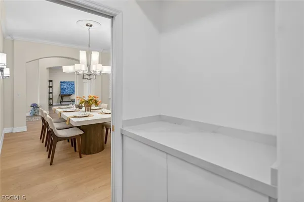 a room with a sink dishwasher and a dining table with garden view