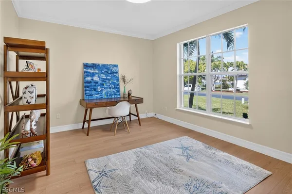 a view of a livingroom with furniture and workspace