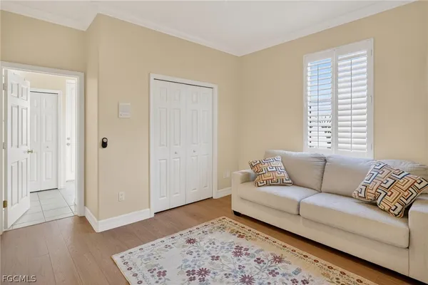 a living room with furniture and a rug