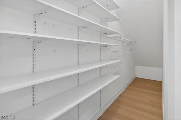 a view of an empty walk in closet