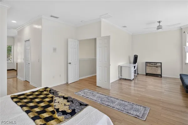 a bedroom with a bed and a view of bathroom