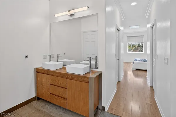 a bathroom with a sink a mirror and a toilet