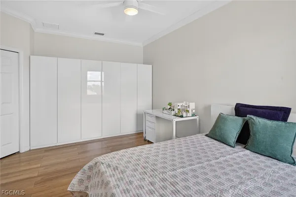 a bedroom with a bed and a closet