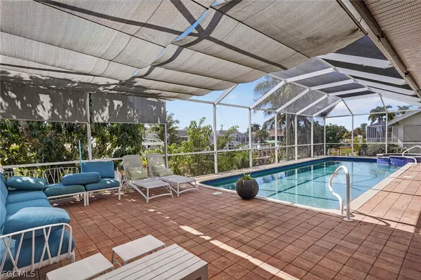 a view of swimming pool with seating space