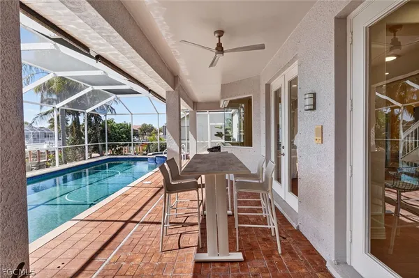 a view of a balcony with chair and wooden floor