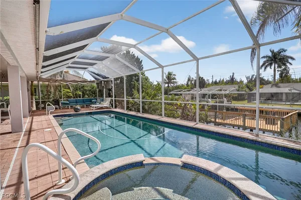 a view of a swimming pool with a patio