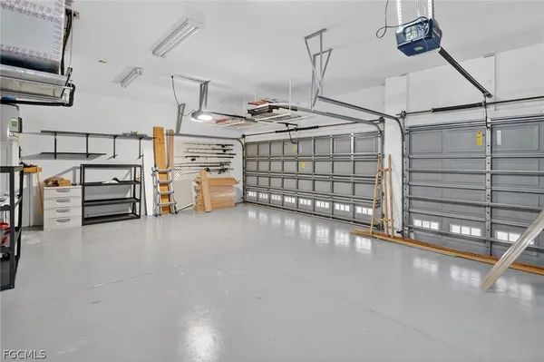a backyard of a house with a fountain table and chairs
