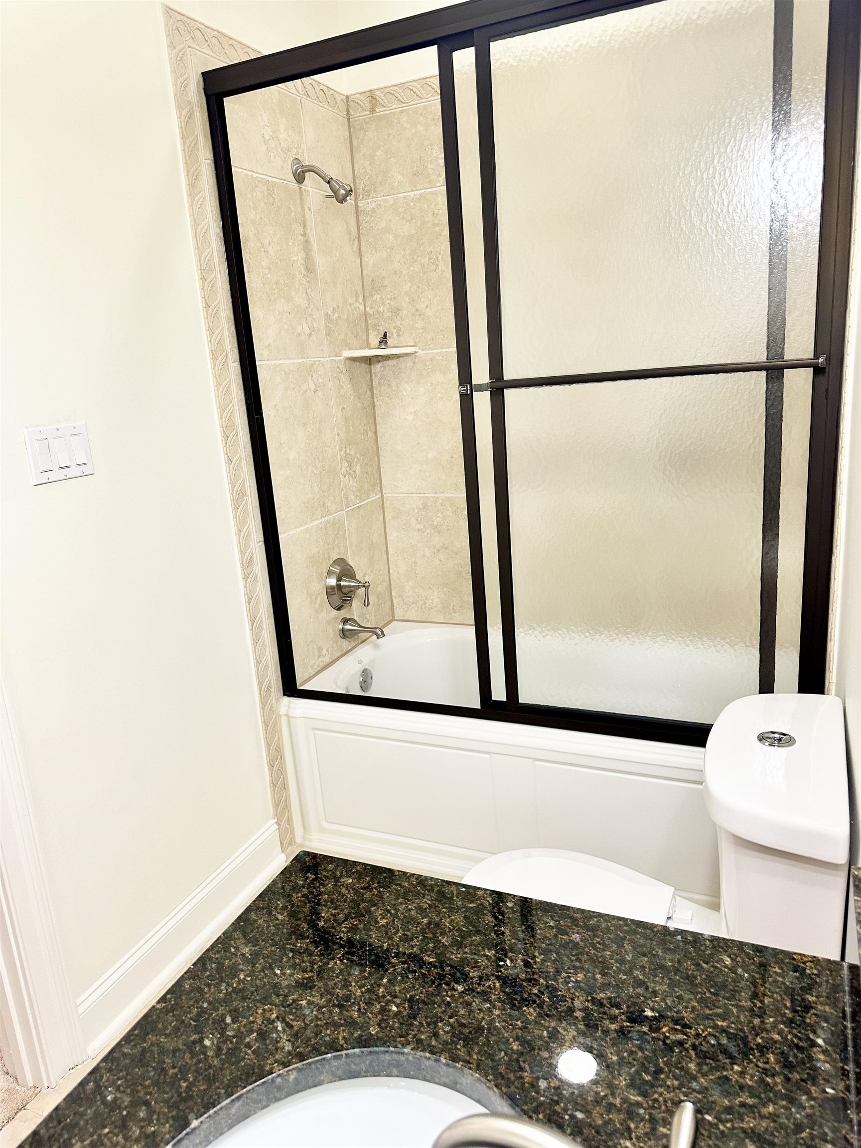 205 Jamerson Farm Road Collierville, TN 38017 - Photo 17 of 33 Bathroom featuring bath / shower combo with glass door and toilet