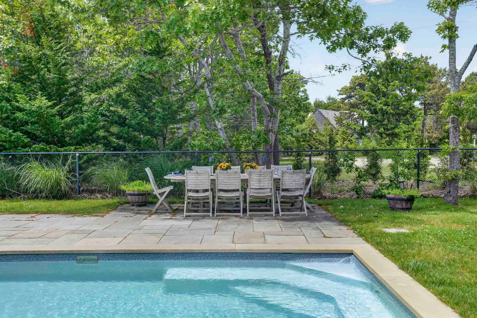 9 Thaxter Lane Edgartown, MA 02539 - Photo 48 of 53 a view of a chair and table in the garden