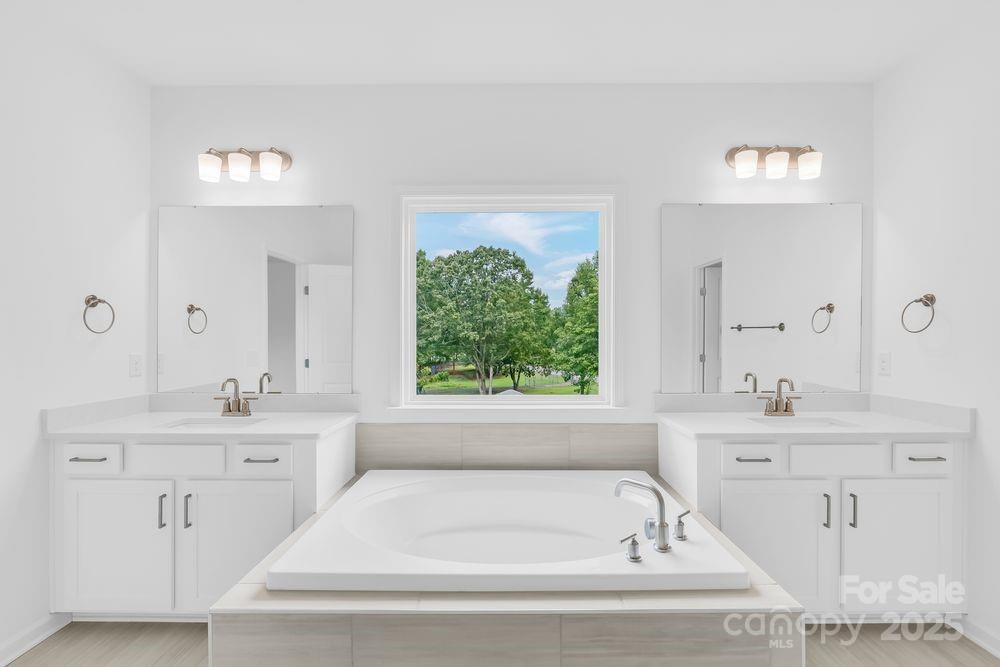 173 Glenn Drive Mooresville, NC 28115 - Photo 14 of 35 a bathroom with a bathtub and a sink