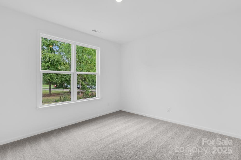 173 Glenn Drive Mooresville, NC 28115 - Photo 18 of 35 an empty room with a window
