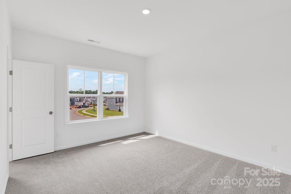 173 Glenn Drive Mooresville, NC 28115 - Photo 19 of 35 a view of an empty room with a window