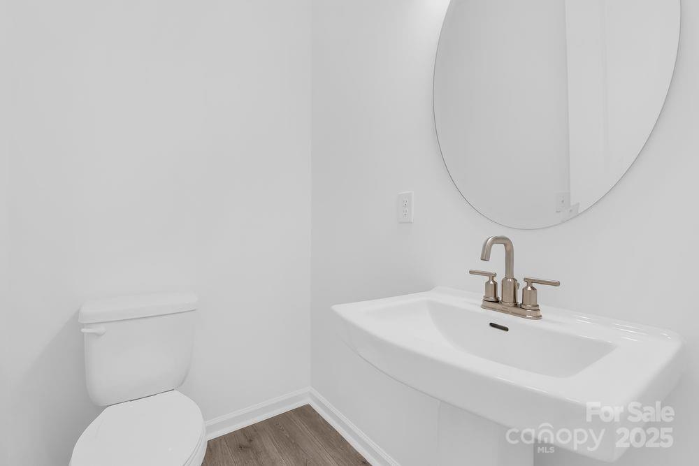 173 Glenn Drive Mooresville, NC 28115 - Photo 24 of 35 a bathroom with a sink mirror and toilet