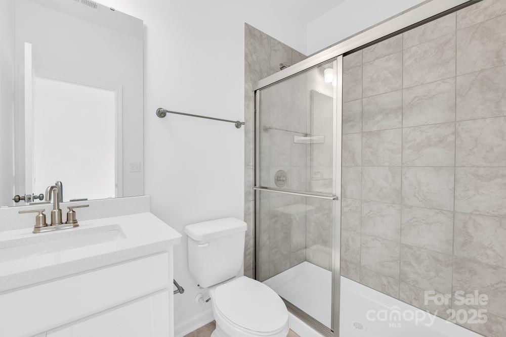 173 Glenn Drive Mooresville, NC 28115 - Photo 26 of 35 a bathroom with a sink a toilet and shower