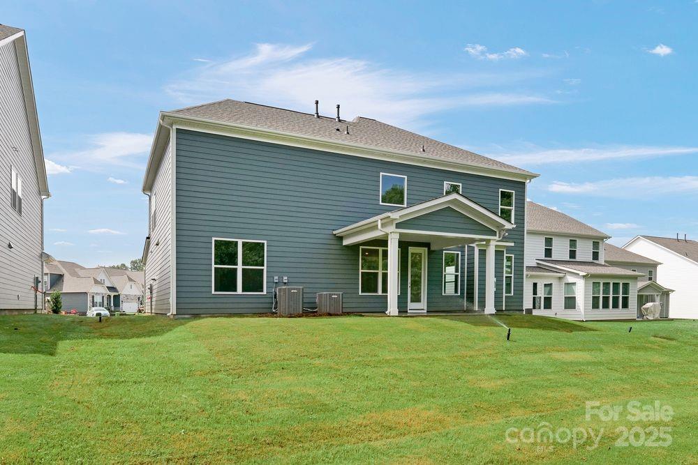 173 Glenn Drive Mooresville, NC 28115 - Photo 29 of 35 a front view of a house with a garden