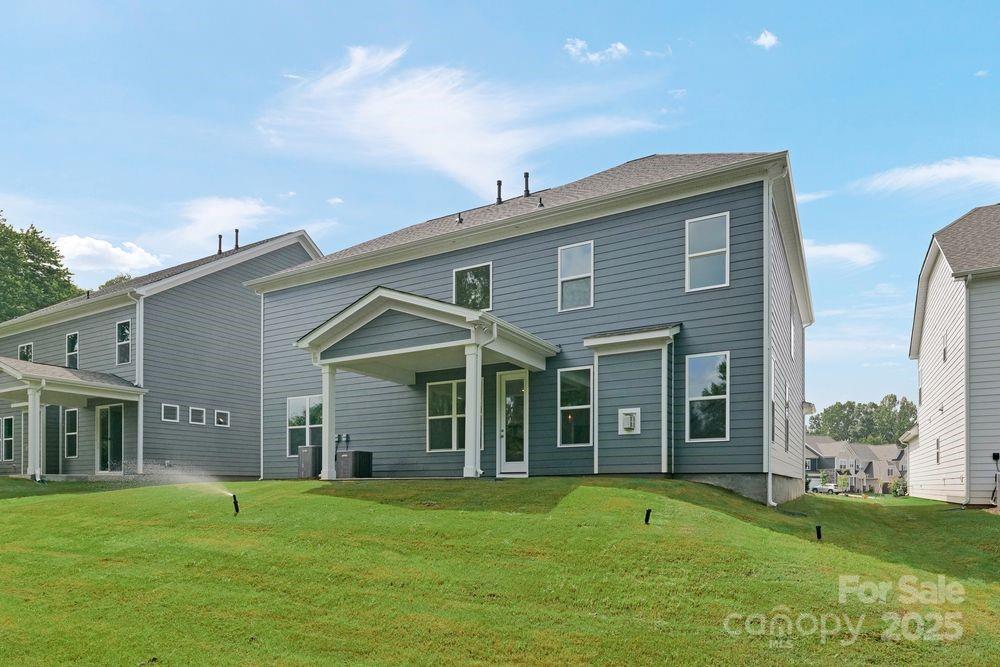 173 Glenn Drive Mooresville, NC 28115 - Photo 30 of 35 a view of an house with backyard space and garden