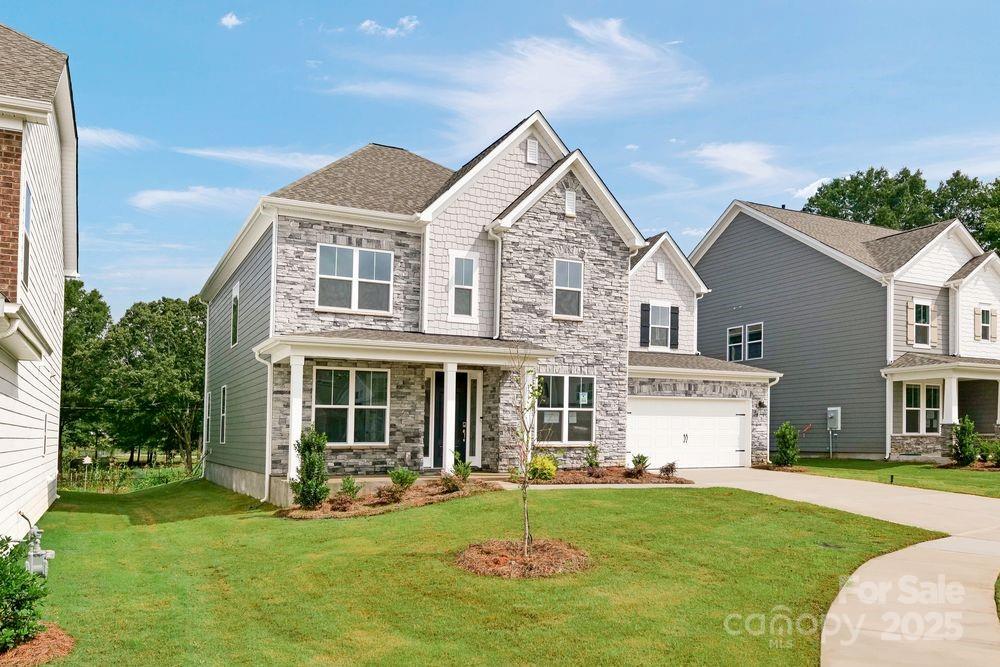 173 Glenn Drive Mooresville, NC 28115 - Photo 31 of 35 a front view of a house with a yard