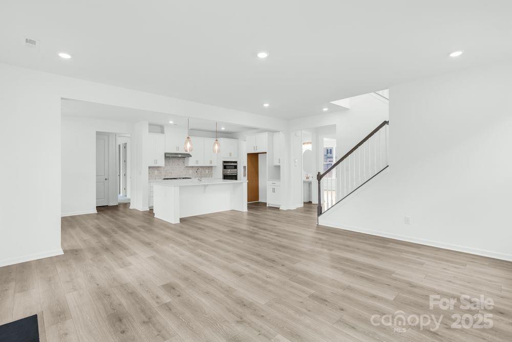 173 Glenn Drive Mooresville, NC 28115 - Photo 8 of 35 a view of a kitchen with a sink and a refrigerator
