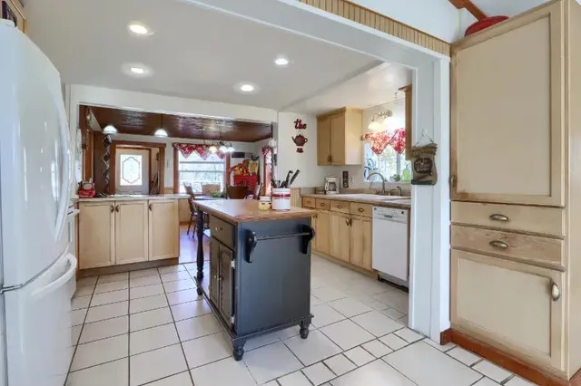 a kitchen with a sink and cabinets
