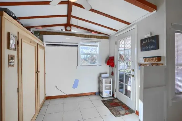 a view of a hallway with bathroom