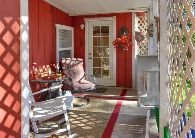 a view of backyard with a table and chairs
