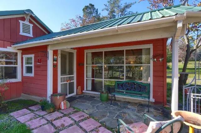 a front view of a house with garden