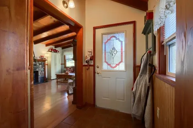 a view of hallway with livingroom and furniture