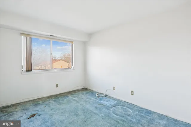 a view of an empty room with window