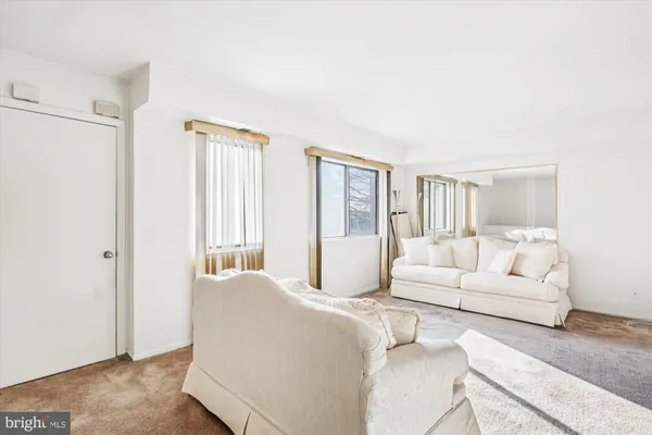 a bedroom with a large bed and a couch