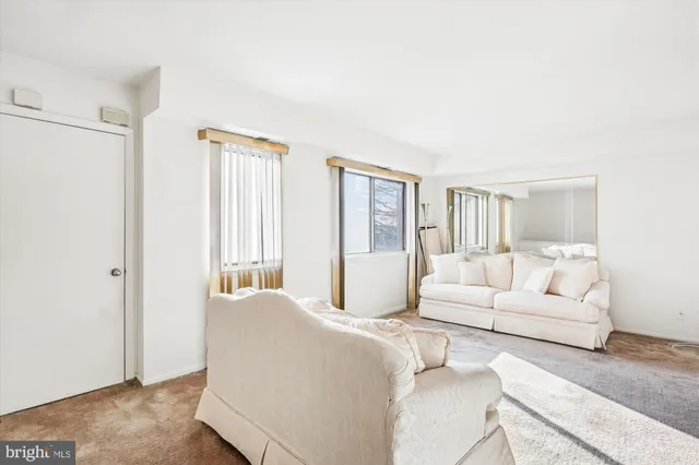 a bedroom with a large bed and a couch