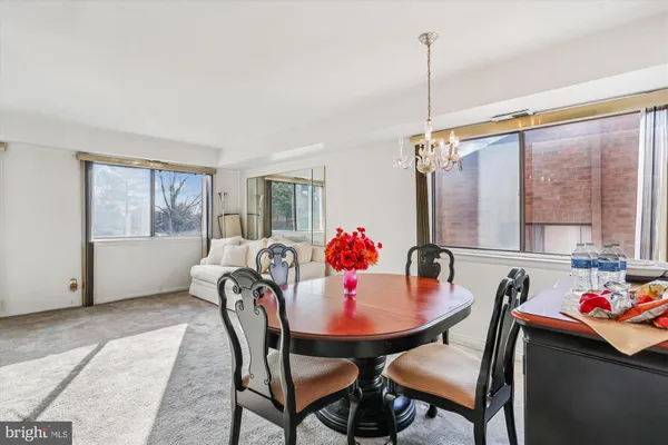 a dining room with furniture and window
