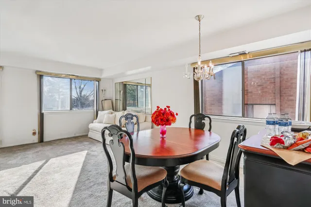 a dining room with furniture and window