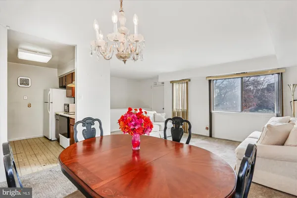 a dining room with furniture and window