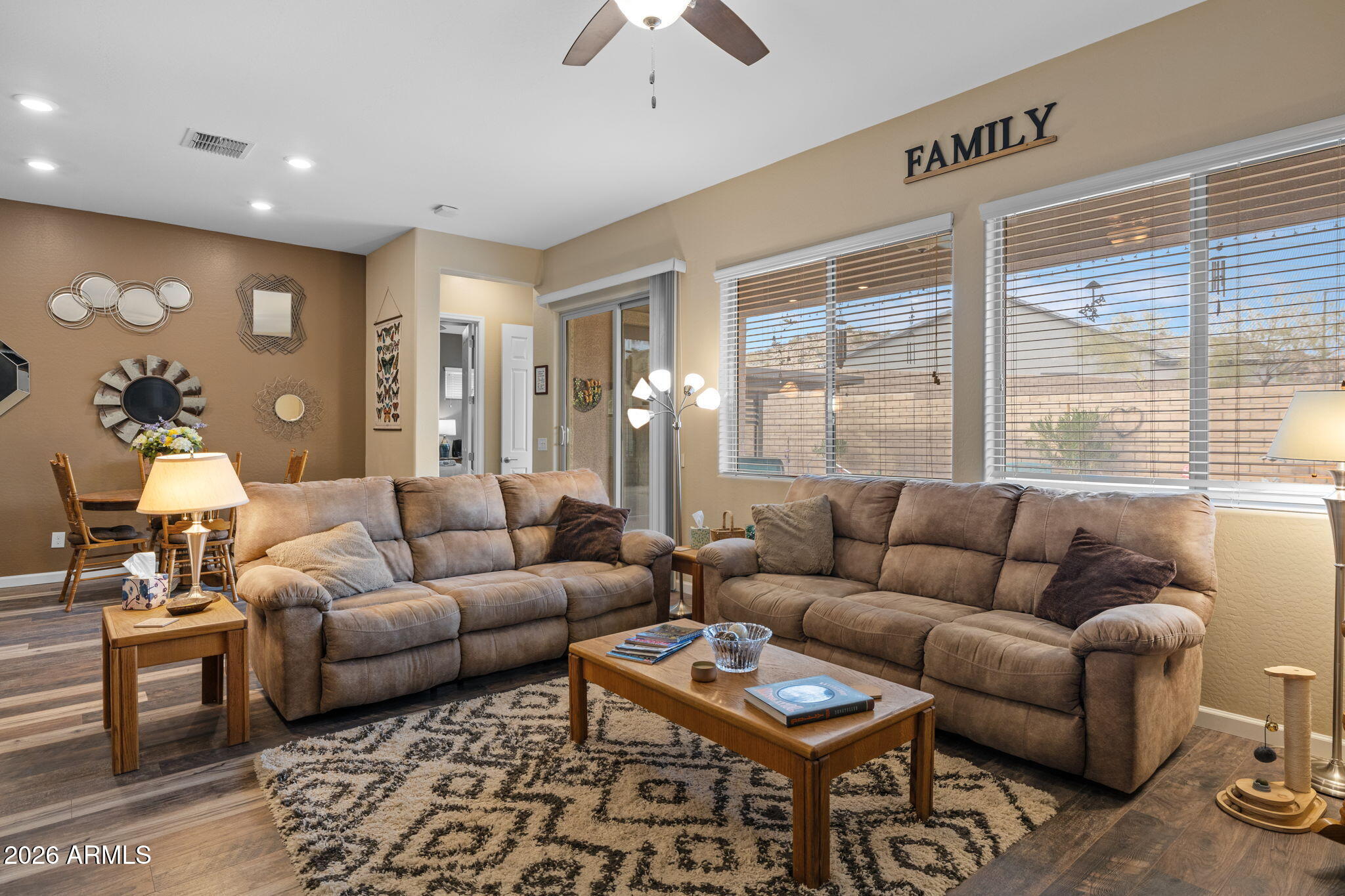 18502 West Desert Trumpet Road Goodyear, AZ 85338 - Photo 13 of 41 a living room with furniture and a large window