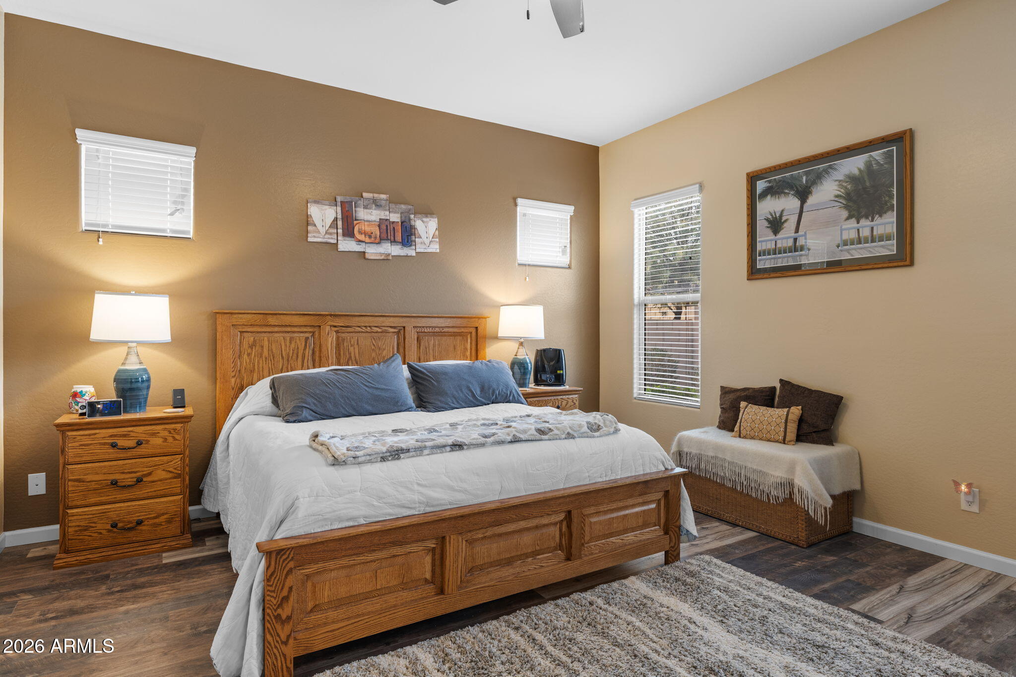 18502 West Desert Trumpet Road Goodyear, AZ 85338 - Photo 19 of 41 a bedroom with a bed and wooden floor