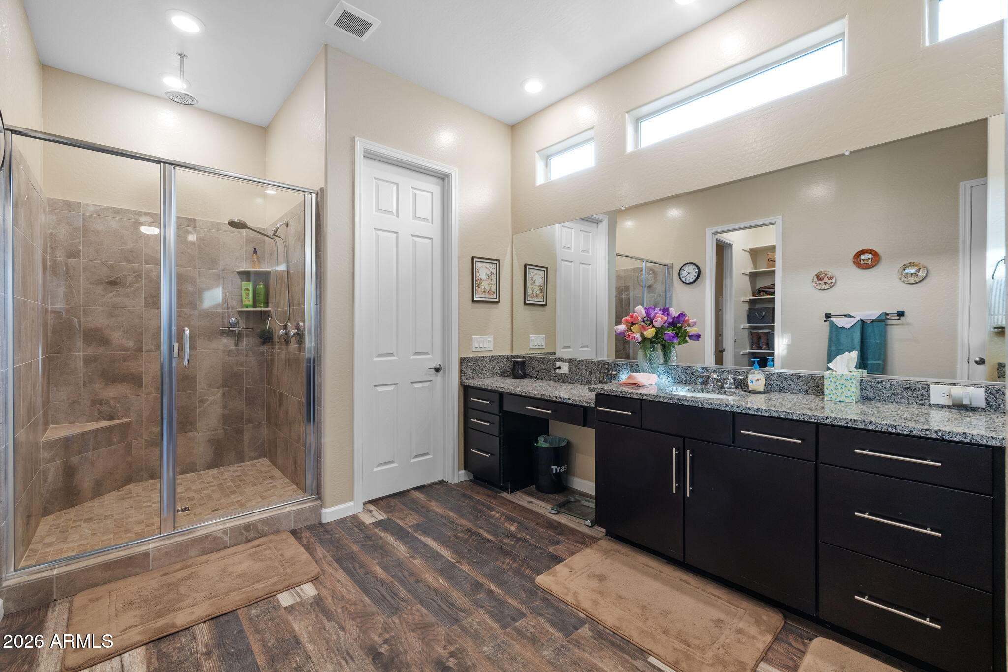 18502 West Desert Trumpet Road Goodyear, AZ 85338 - Photo 23 of 41 a bathroom with a granite countertop sink mirror and double