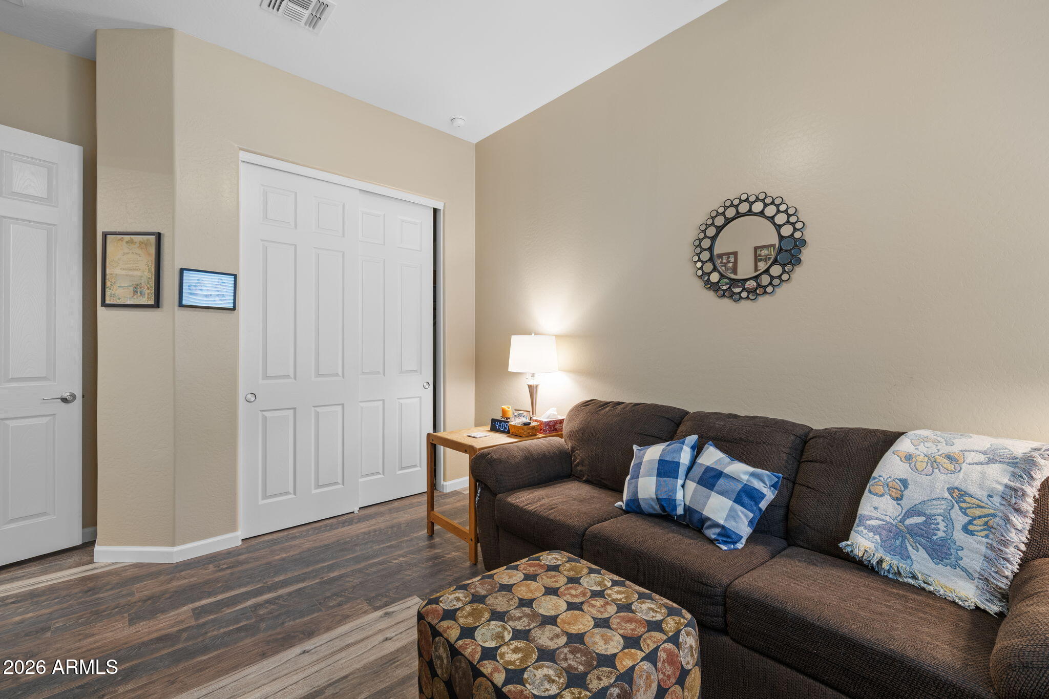 18502 West Desert Trumpet Road Goodyear, AZ 85338 - Photo 27 of 41 a living room with furniture and a wooden floor