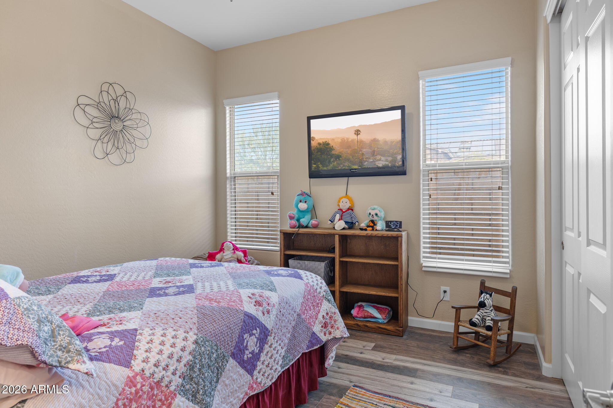 18502 West Desert Trumpet Road Goodyear, AZ 85338 - Photo 28 of 41 a bedroom with a bed and a flat screen tv
