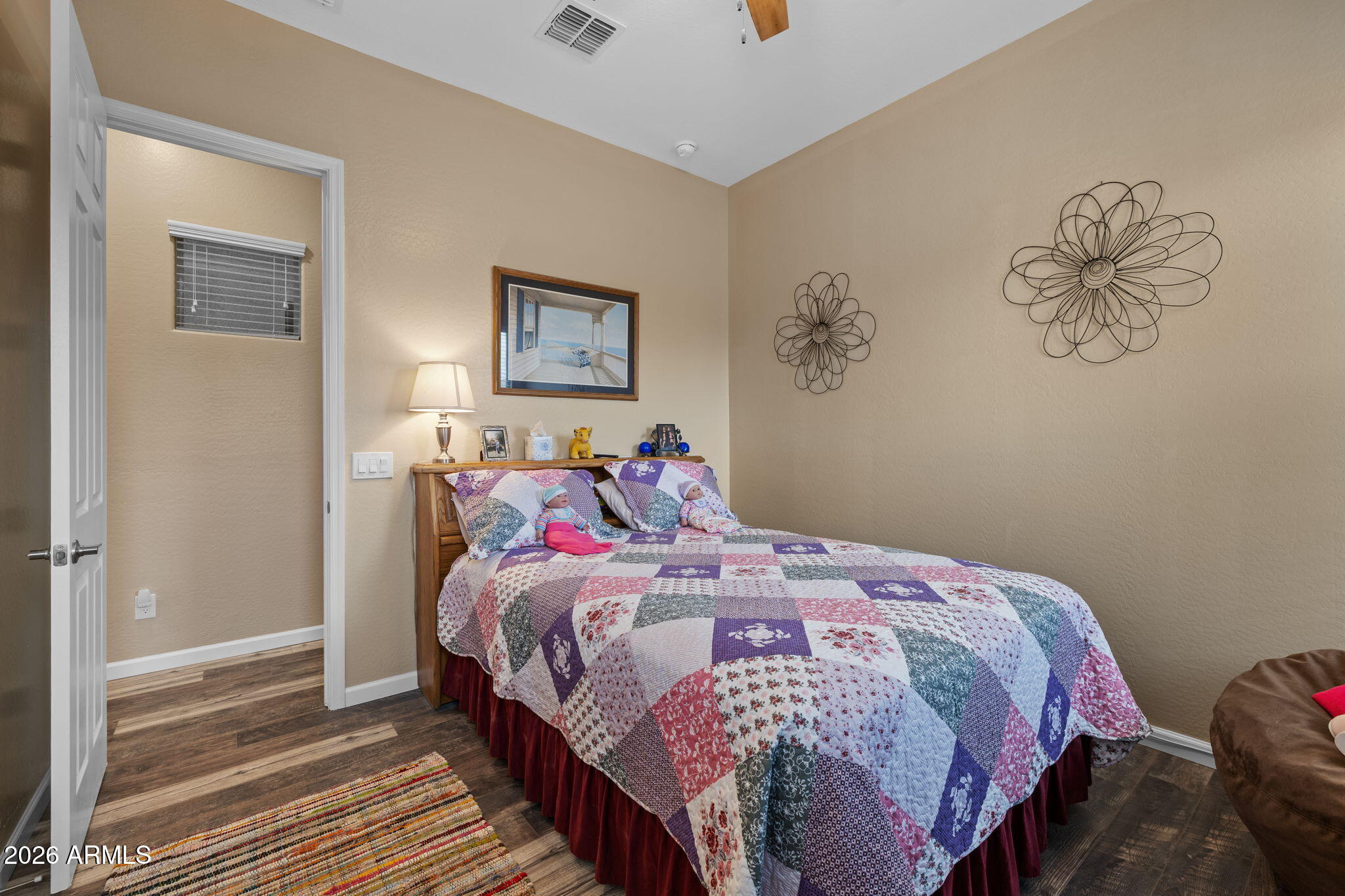 18502 West Desert Trumpet Road Goodyear, AZ 85338 - Photo 29 of 41 a bedroom with a bed and wall painting