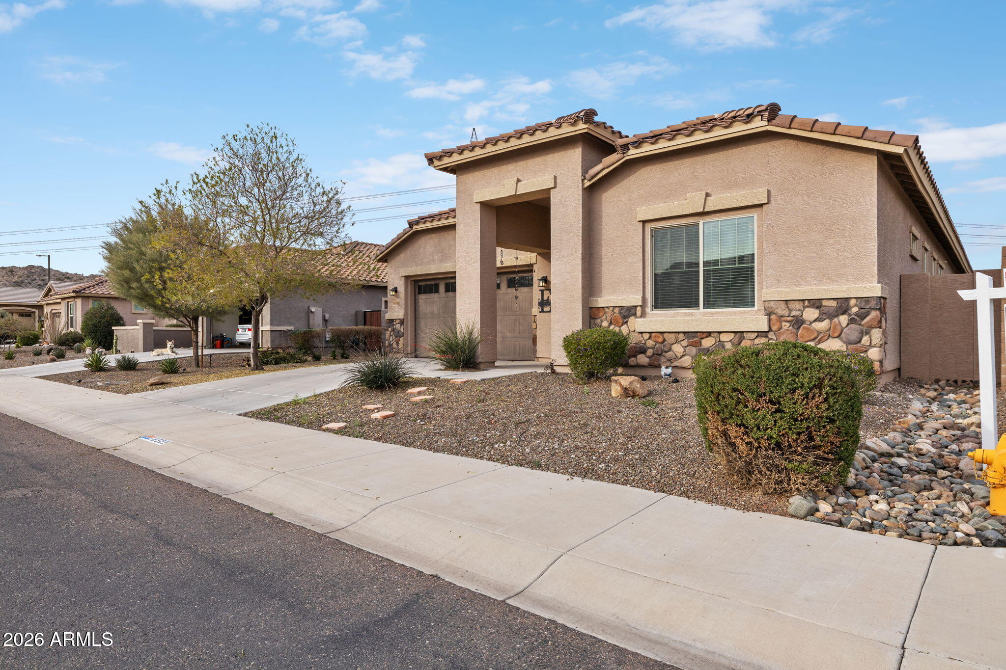 18502 West Desert Trumpet Road Goodyear, AZ 85338 - Photo 3 of 41 a front view of a house with entertaining space