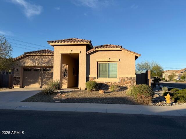 18502 West Desert Trumpet Road Goodyear, AZ 85338 - Photo 40 of 41 a front view of a house with car parked