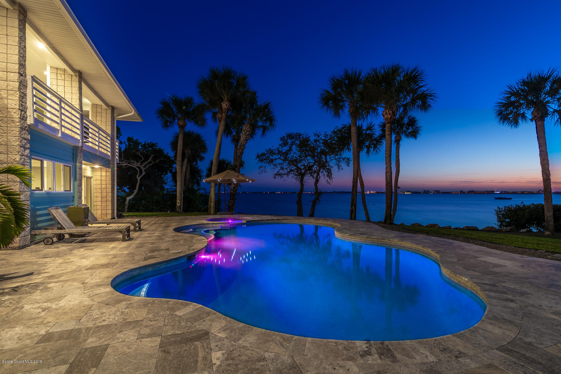 400 Richards Road Melbourne Beach, FL 32951 - Photo 3 of 59 a swimming pool with outdoor seating