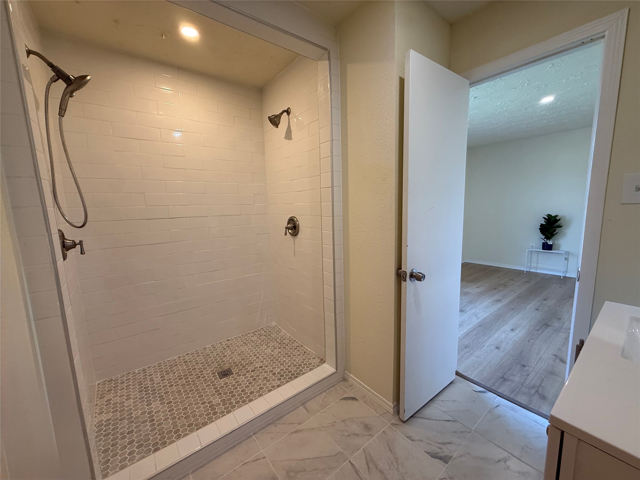 4546 Connorvale Road Houston, TX 77039 - Photo 21 of 25 a bathroom with a glass shower door