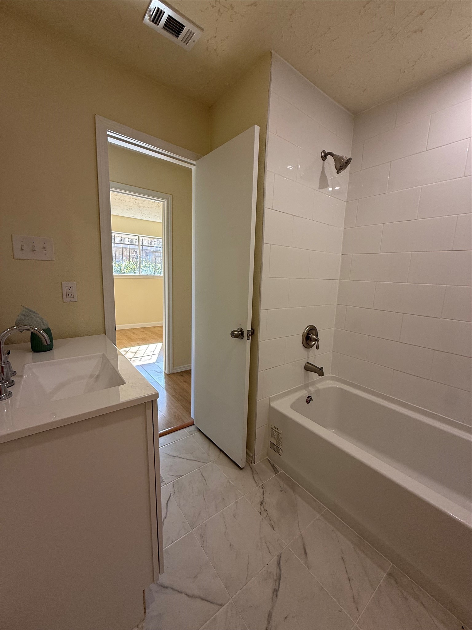 4546 Connorvale Road Houston, TX 77039 - Photo 23 of 25 a spacious bathroom with a tub sink and mirror
