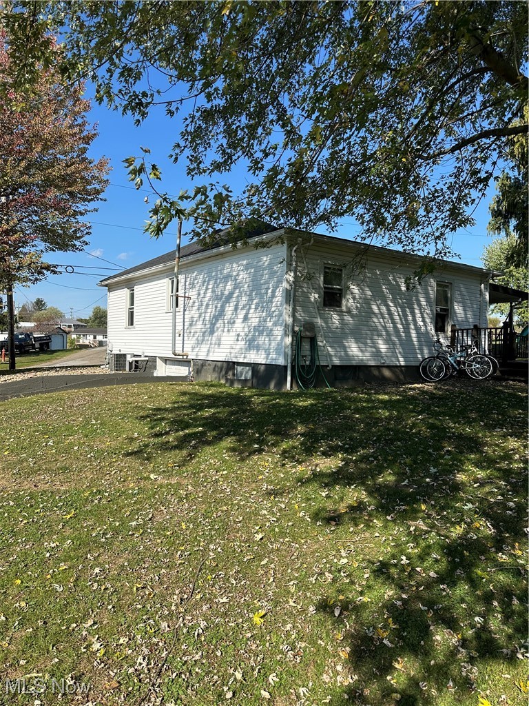 422 Moose Ridge Road Woodsfield, OH 43793 - Photo 6 of 43 View of side along with the rear of property featuring a lawn