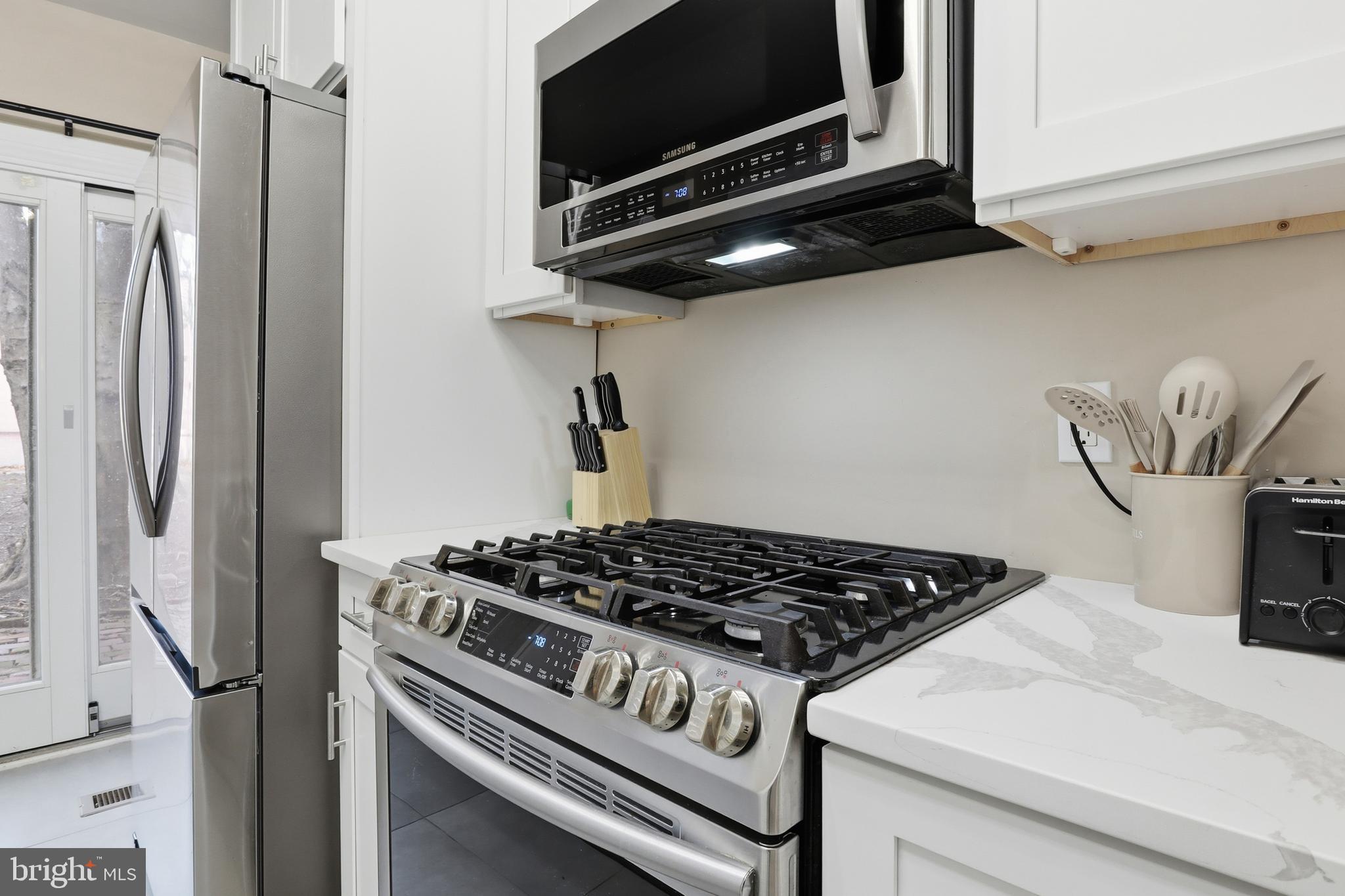 547 South Front Street Harrisburg, PA 17104 - Photo 12 of 33 a kitchen with stainless steel appliances granite countertop a stove and a refrigerator